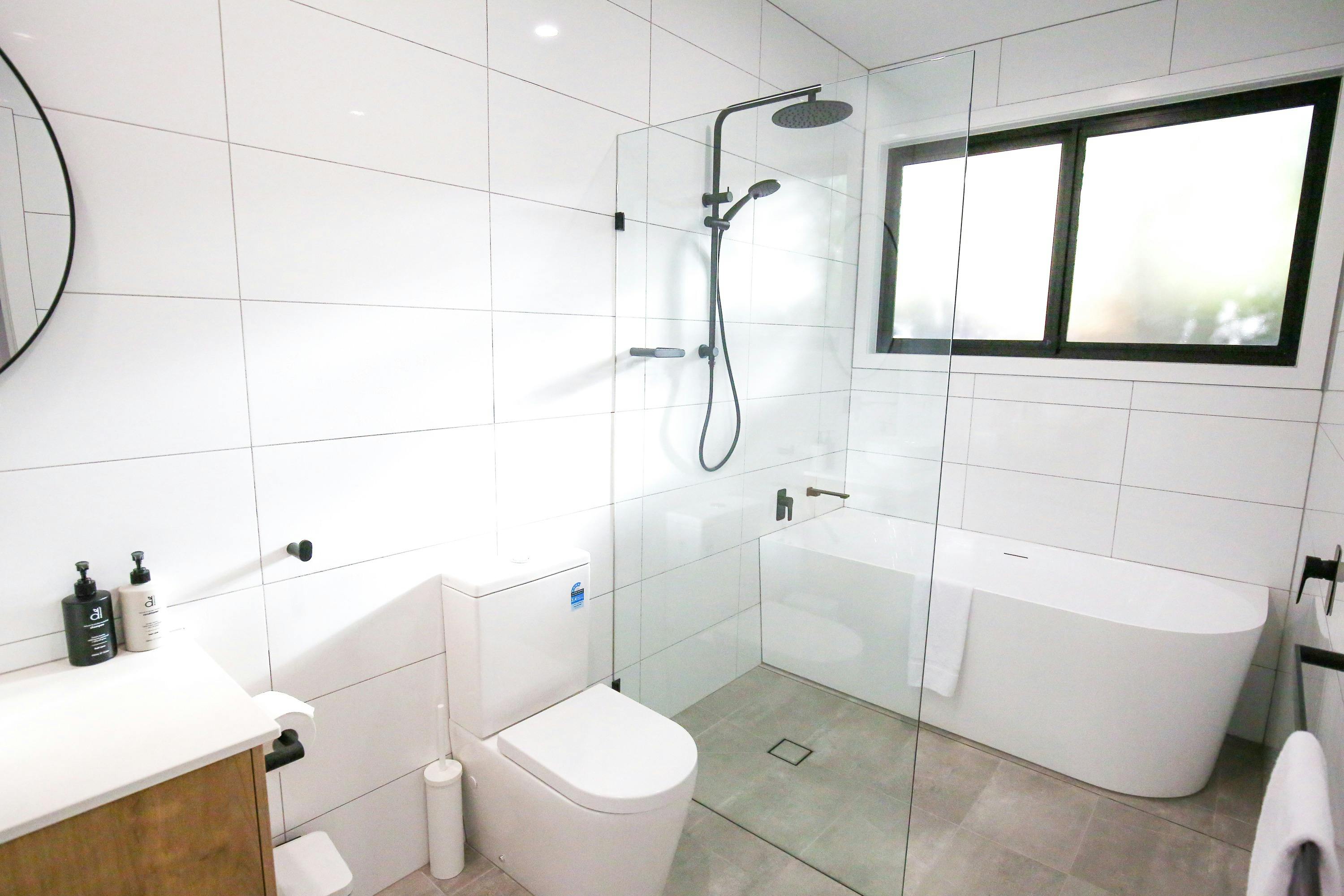 Bathroom with bath at Apex Outlook