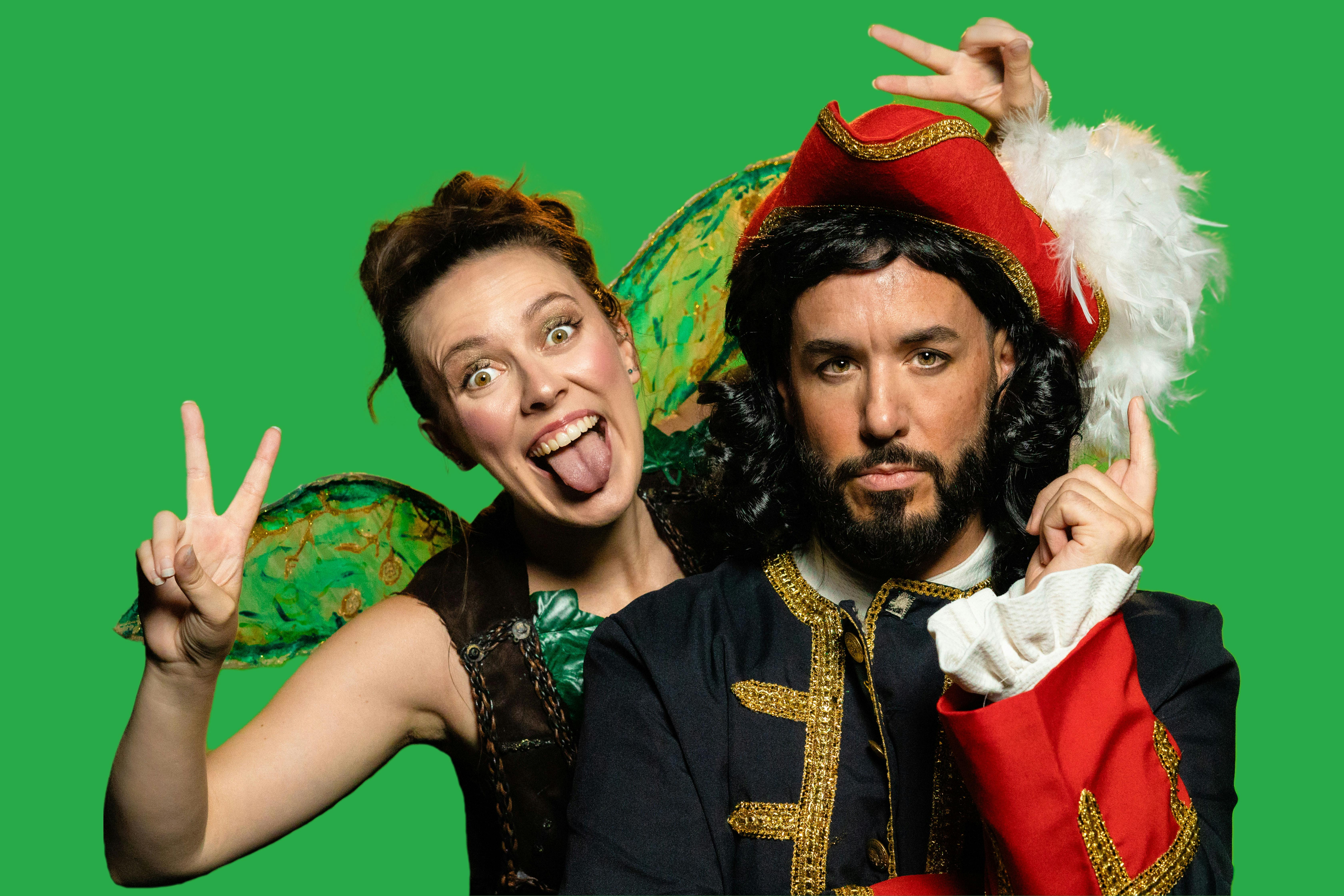 A real-life green fairy and pirate captain in front of a green background