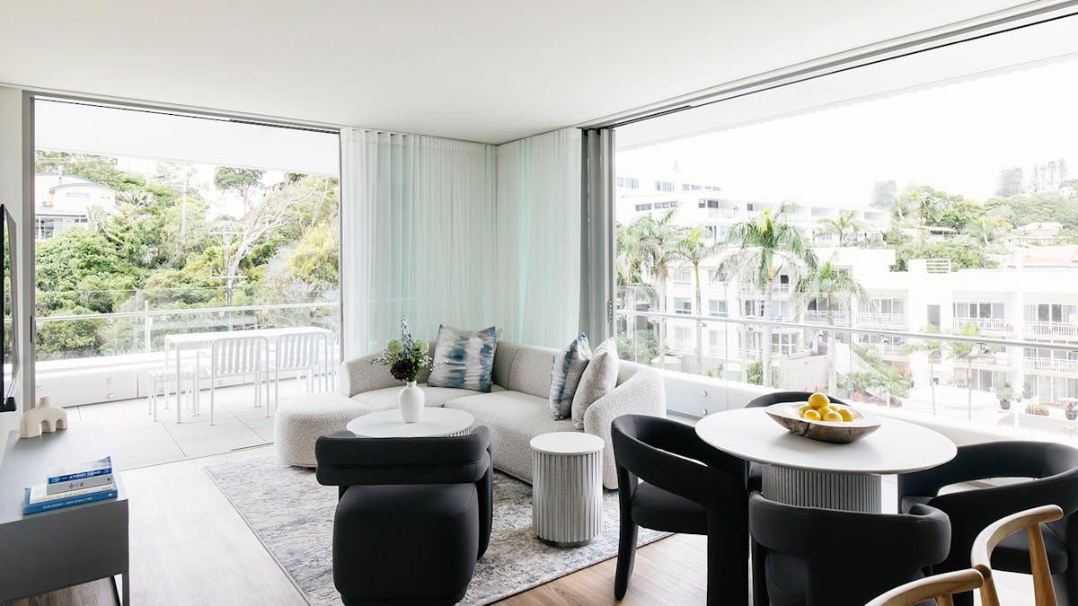 Light-filled Kirra Point apartment with balcony, lush views, and stylish coastal interiors.