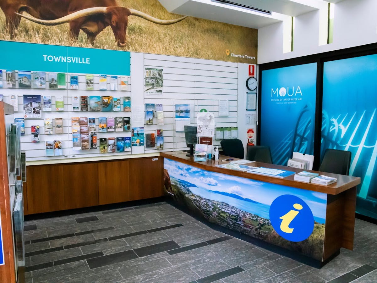 Inside view with Info Desk at the front and brochures on the walls surrounding