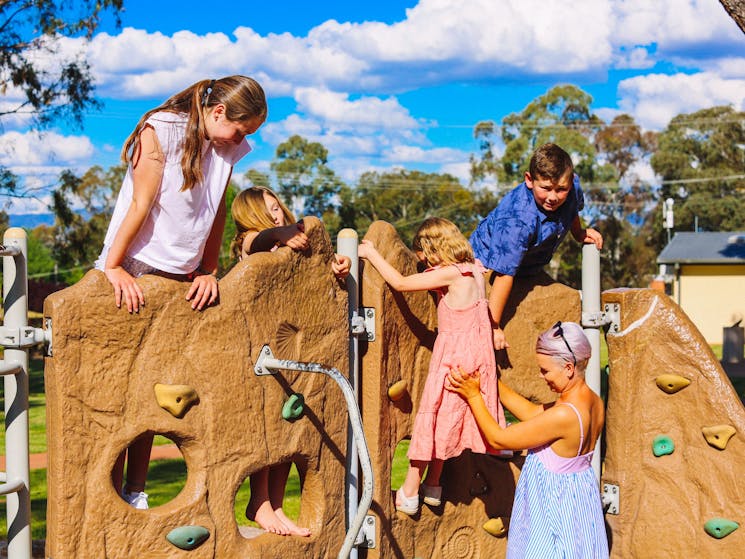 Kids playing on the rock climbing wall