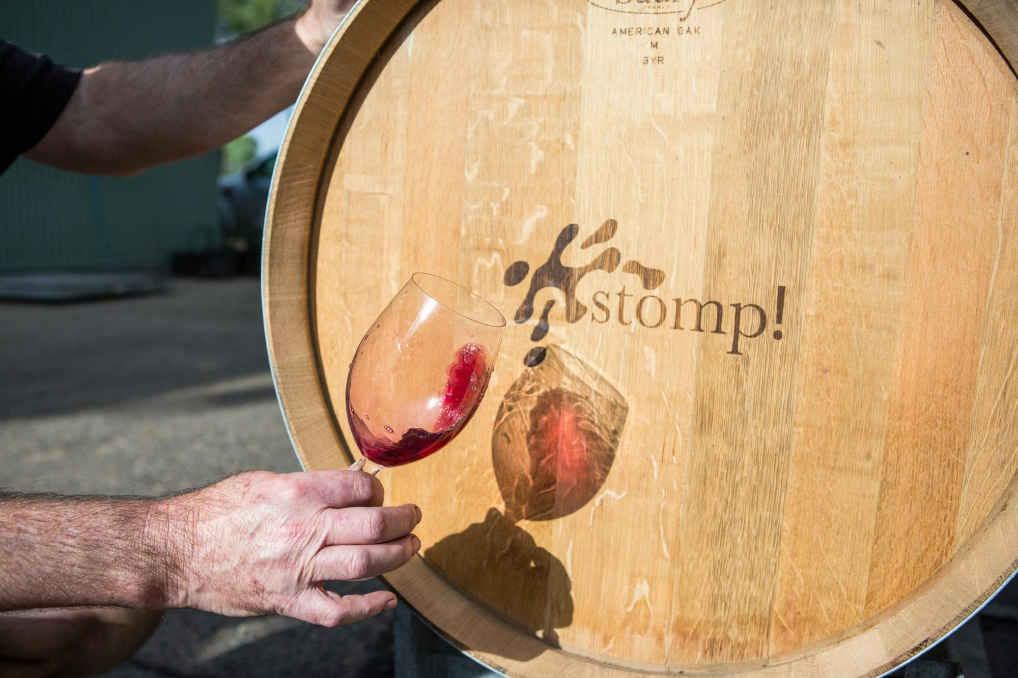 Wine glass in front of barrel