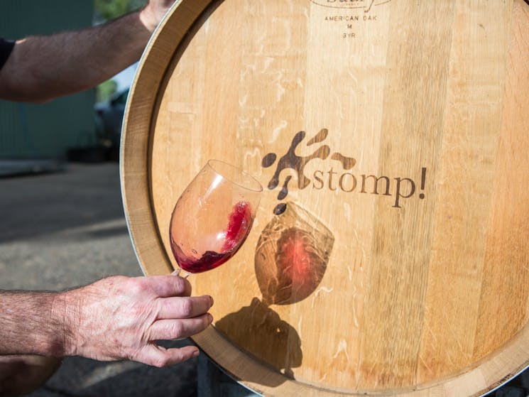 Wine glass in front of barrel