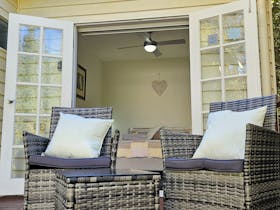 Coonawarra Experiences - Private deck seating outside cosy guest bedroom with open French doors