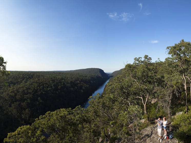 Couple walking near 'The Rock' lookout at Nepean River, Penrith