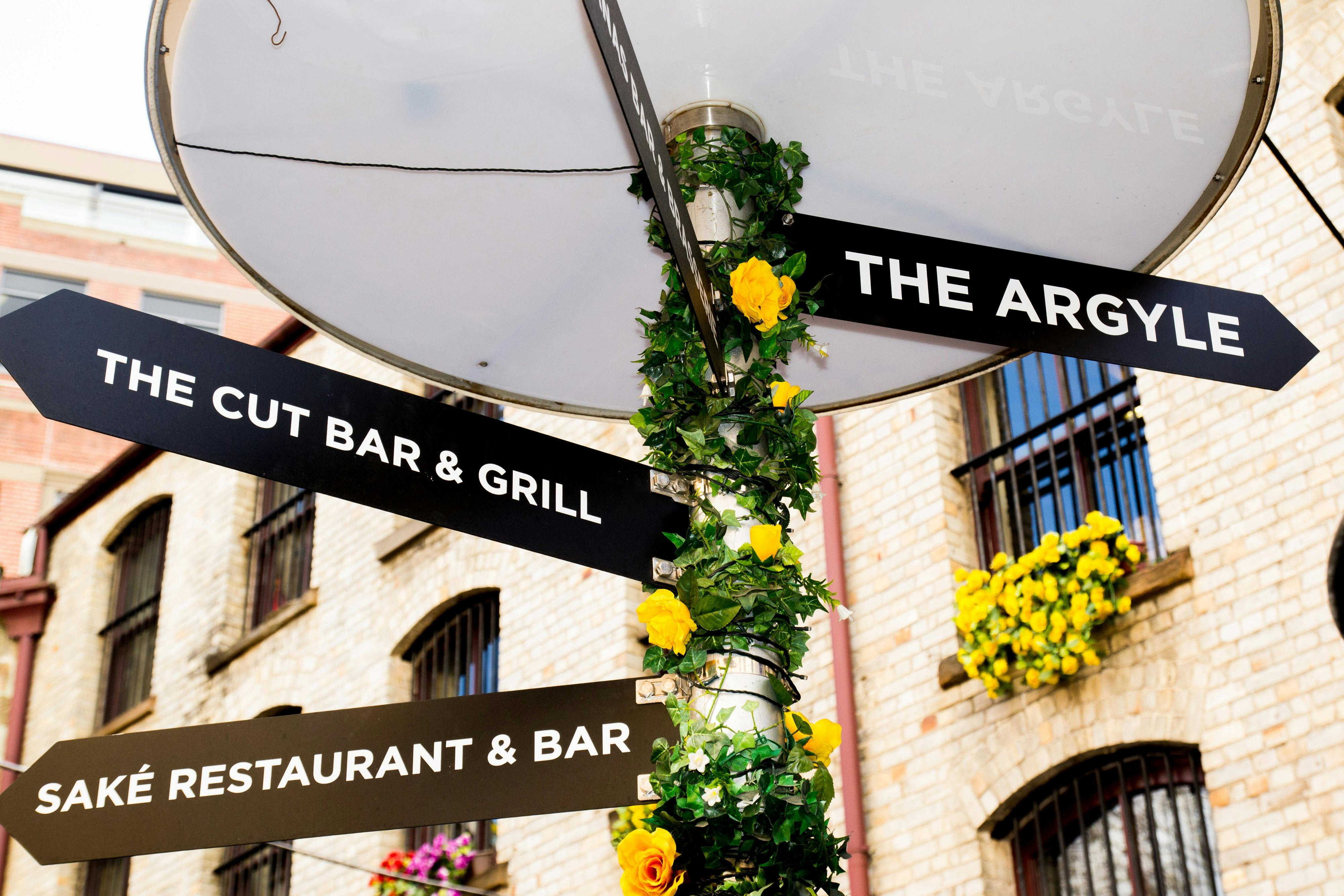 A sign post with three Rocks location lanes