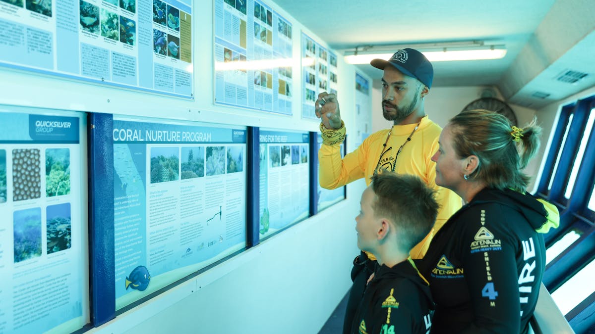 Master Reef Guide and family in underwater observatory