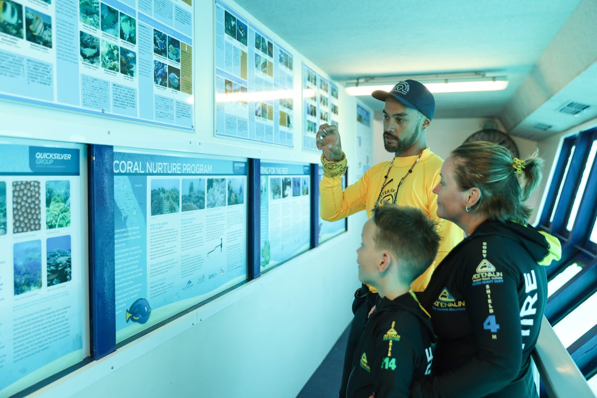 Master Reef Guide and family in underwater observatory