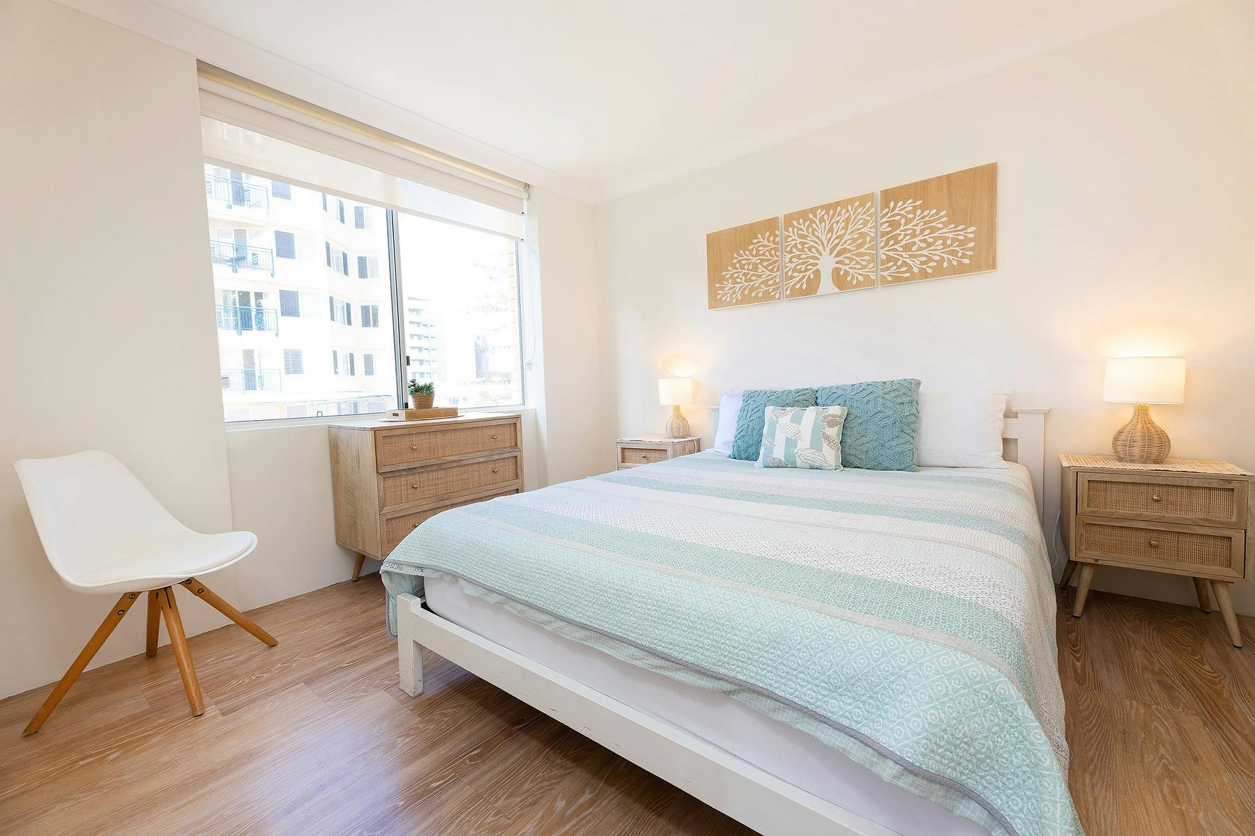 Master bedroom with Queen bed and modern rattan bedroom suite