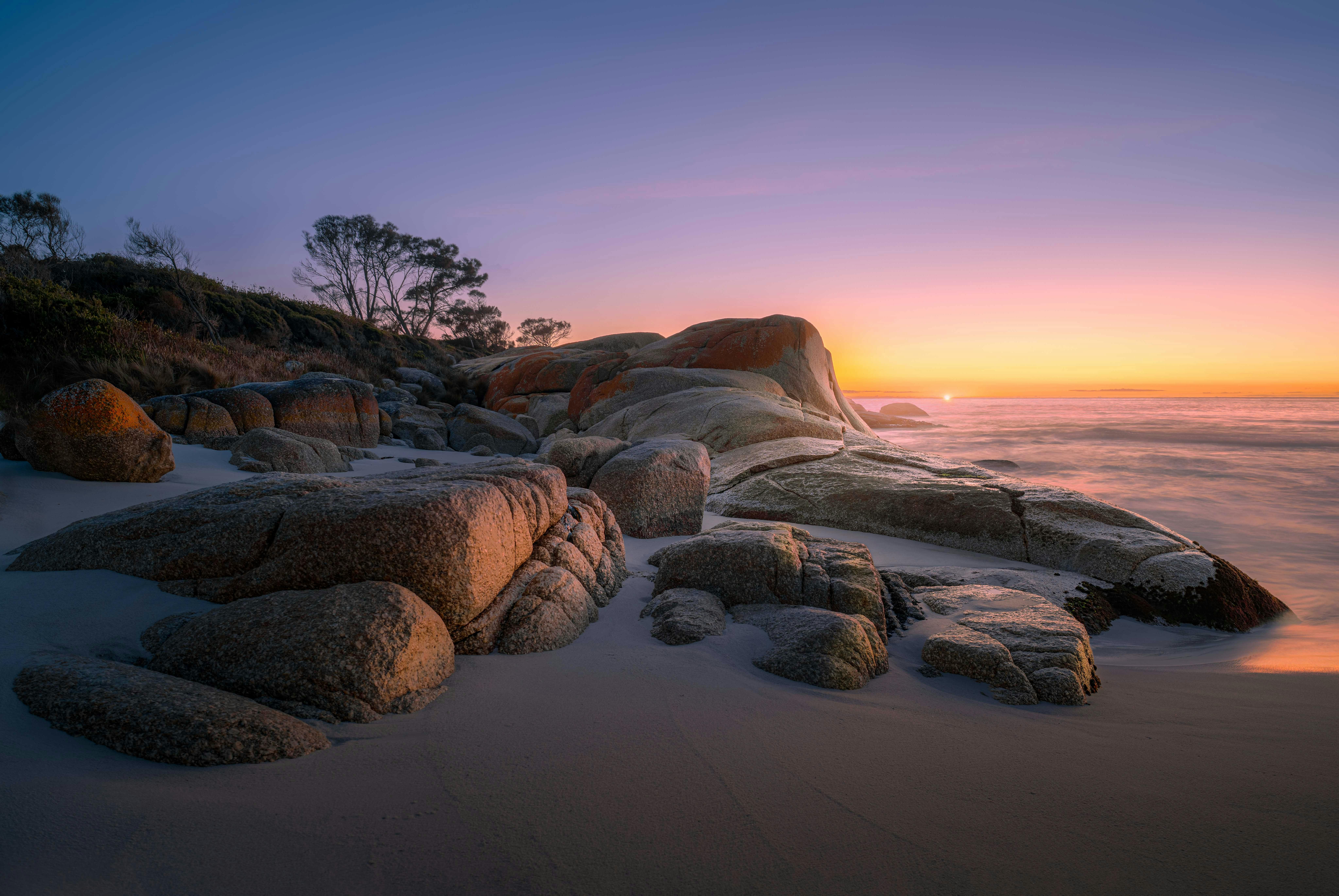 sunrise on the bay of fires tasmania