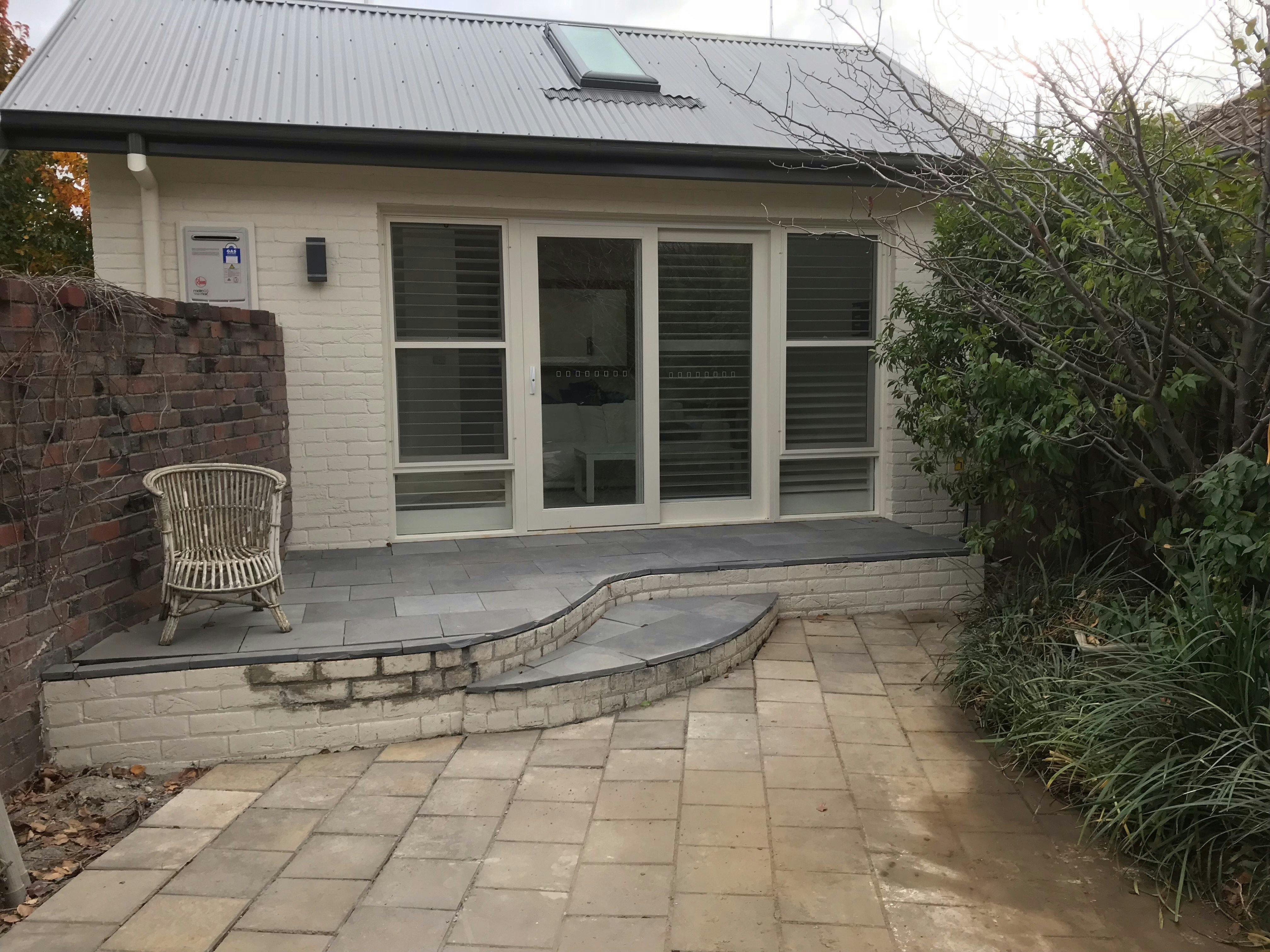 Brick exterior with plantation shutters. Off street parking