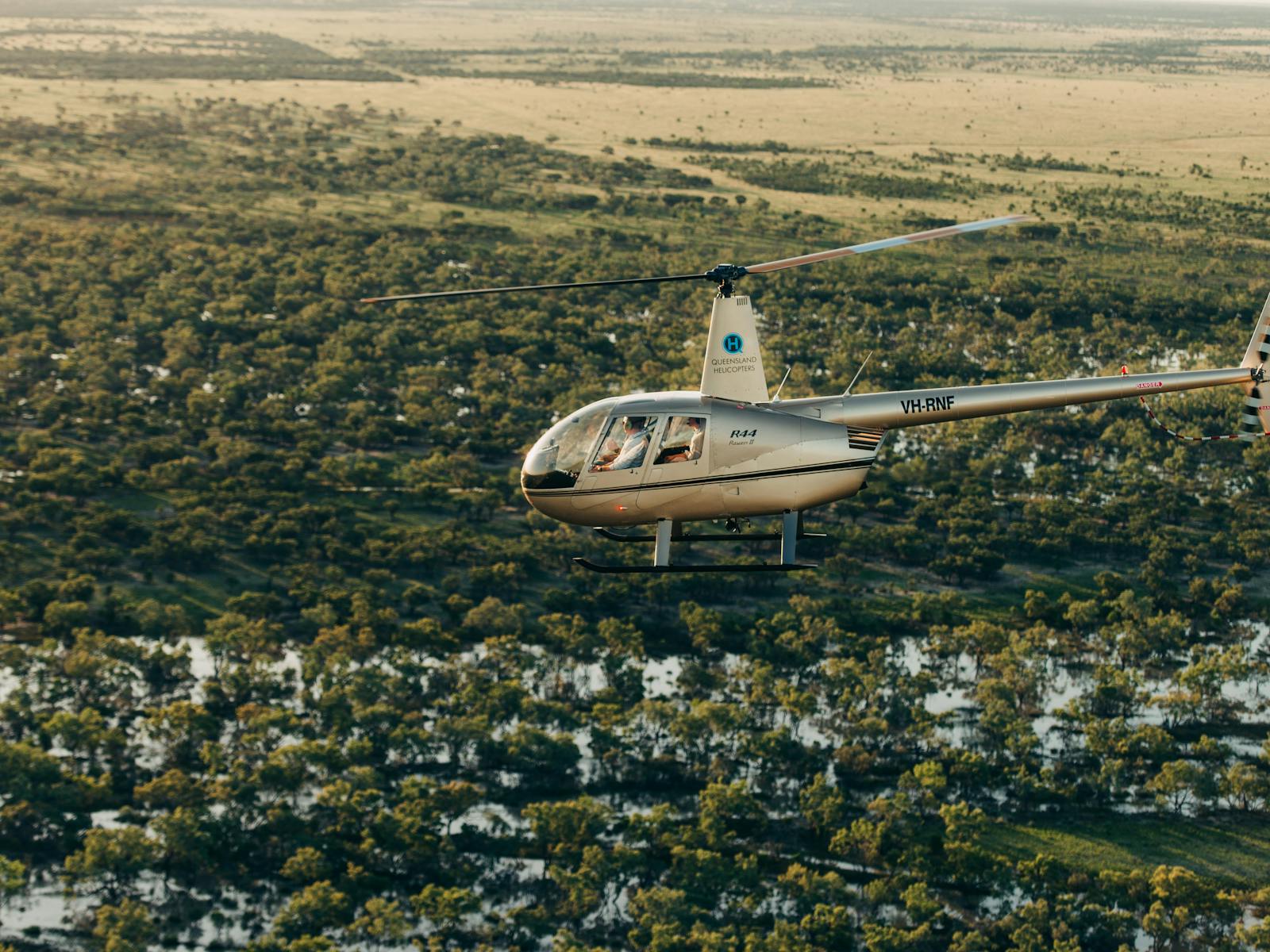 R44 helicopters flying over channel country