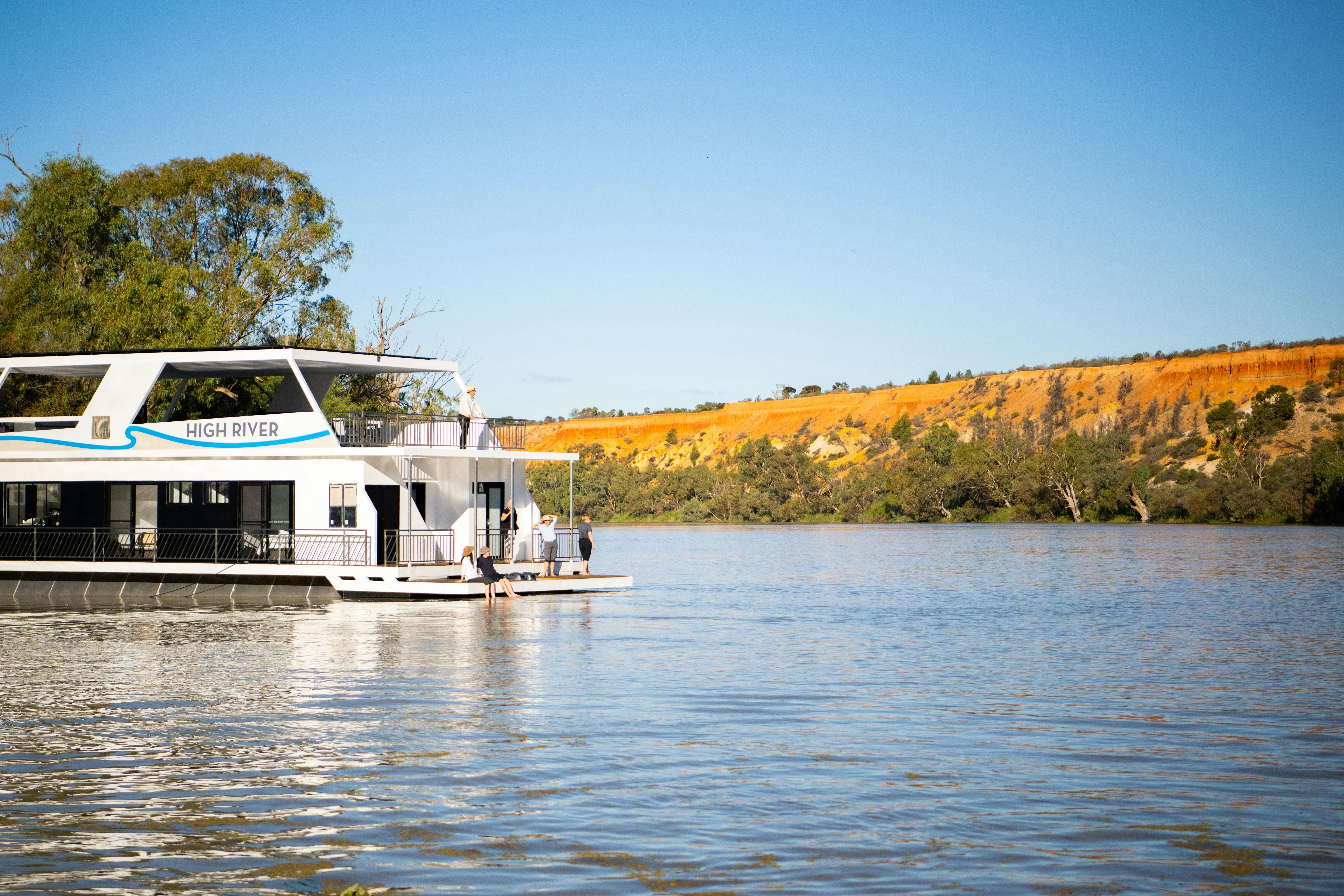 People relaxing on a houseboat murray river