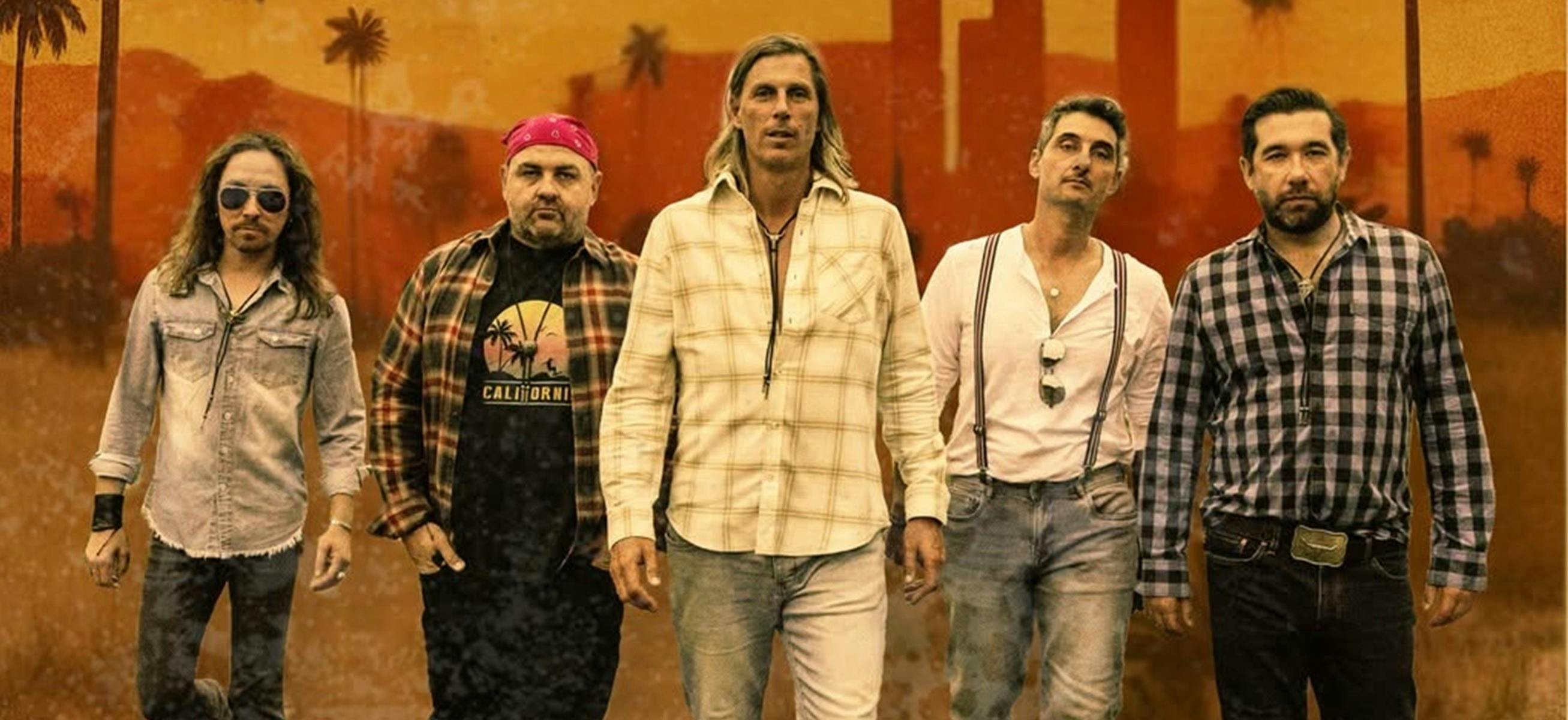 Members of band with Californian backdrop