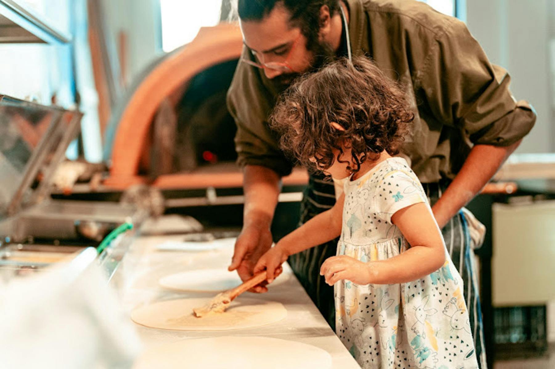 Teaching my little niece how to make pizza