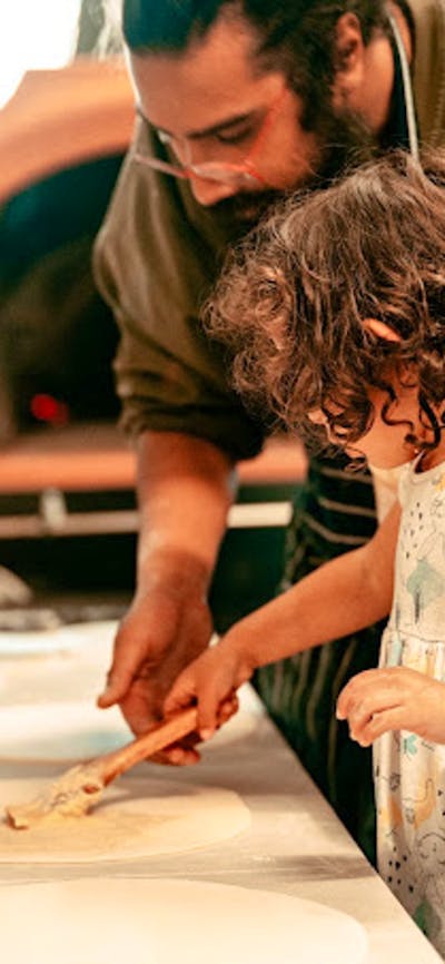 Teaching my little niece how to make pizza