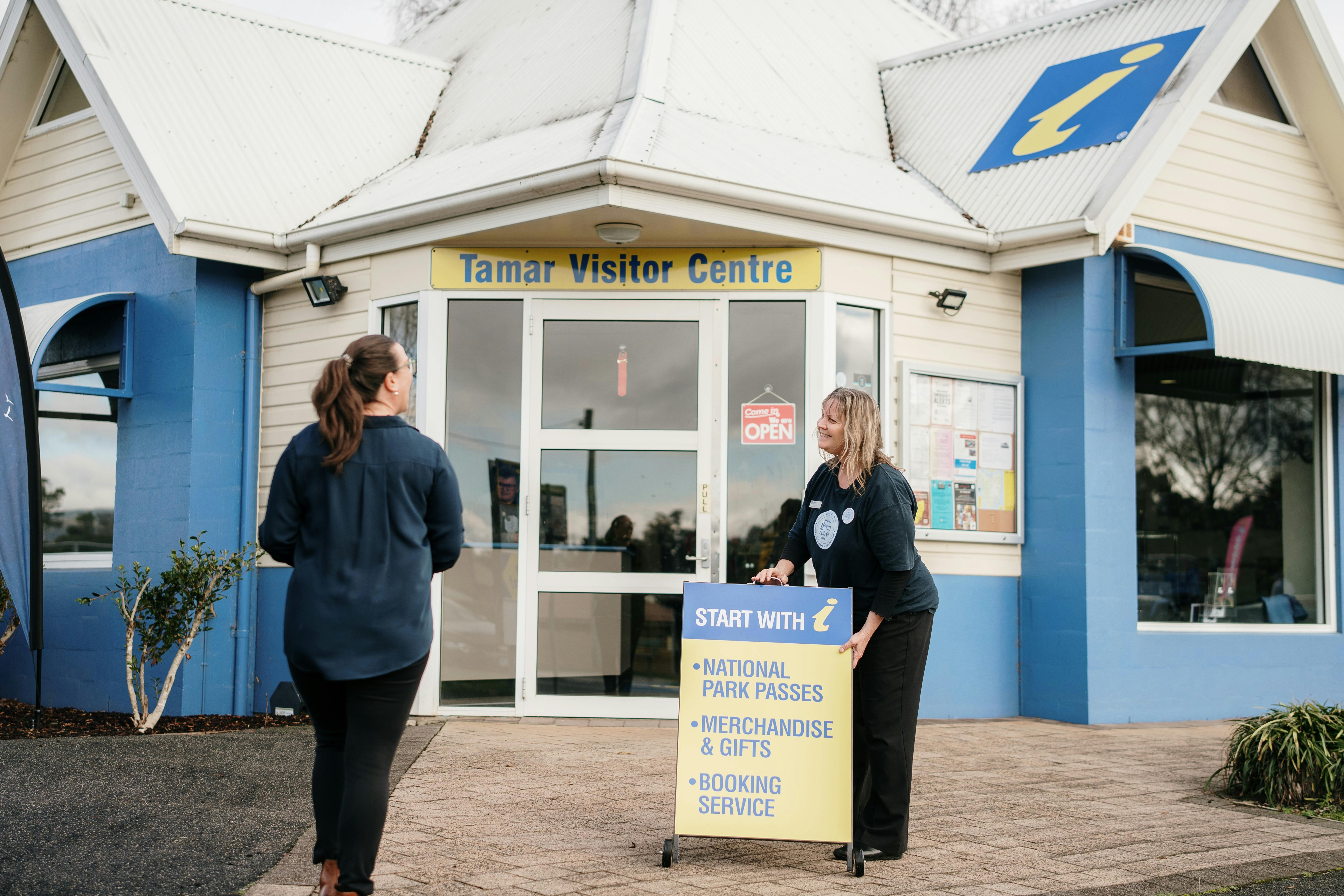 Staff out the front of the Information Centre greeting guest