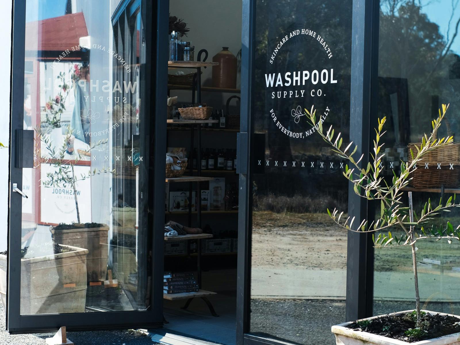 Image of Washpool front doors with olive trees outside. Image of Washpool front doors with olive trees outside.