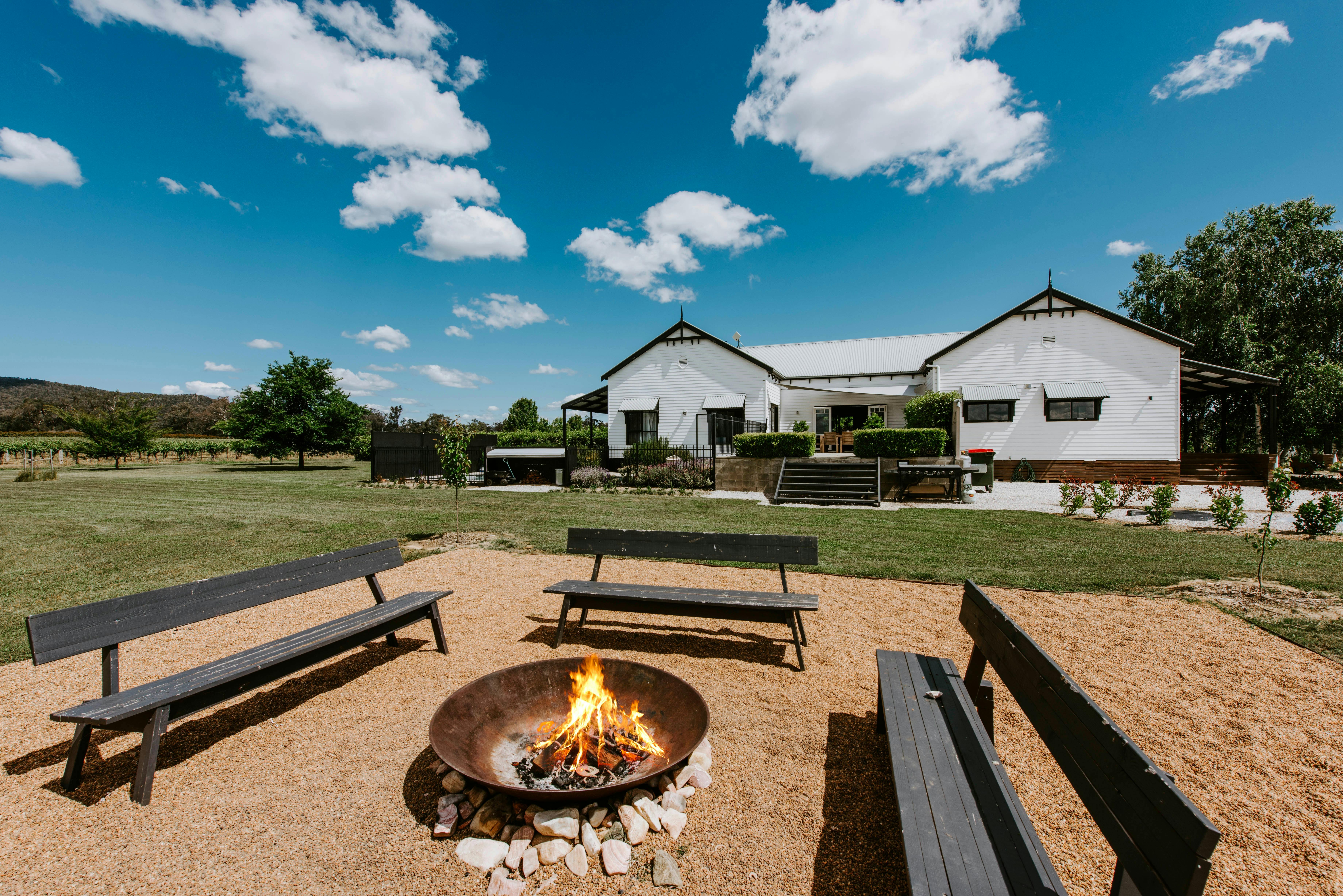 Outdoor fire pit and seating area at The Farmhouse, Blue Wren Farm, Mudgee