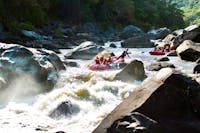 Wide Scenic Shot of two Rafting boats approaching the rooster tail rapid on the Barron River