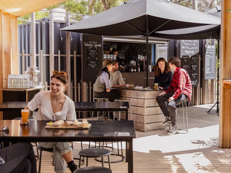 People sitting outside drinking beer on Bruny Island