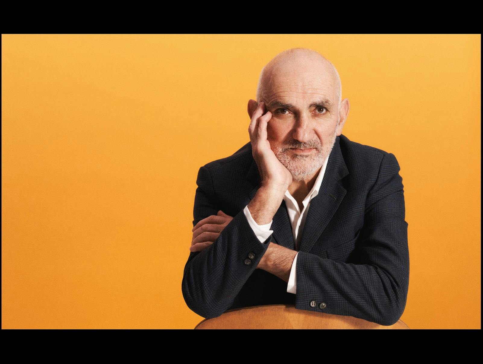 Paul Kelly leaning on arm