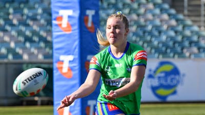 Canberra Raiders NRLW player Lili Boyle passing the ball.