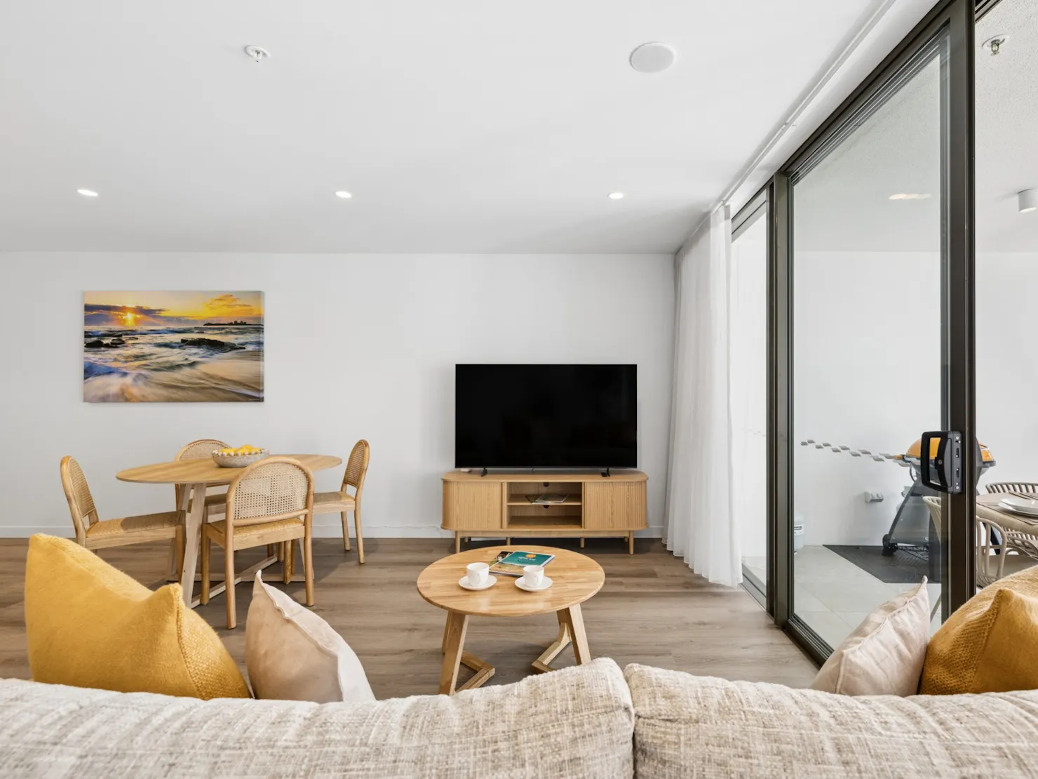 Living area with Smart TV and balcony access