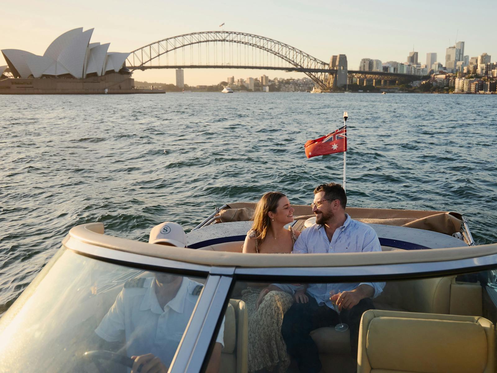 Private boat tour on MV Aquamajestic cruising Sydney Harbour with city skyline views.