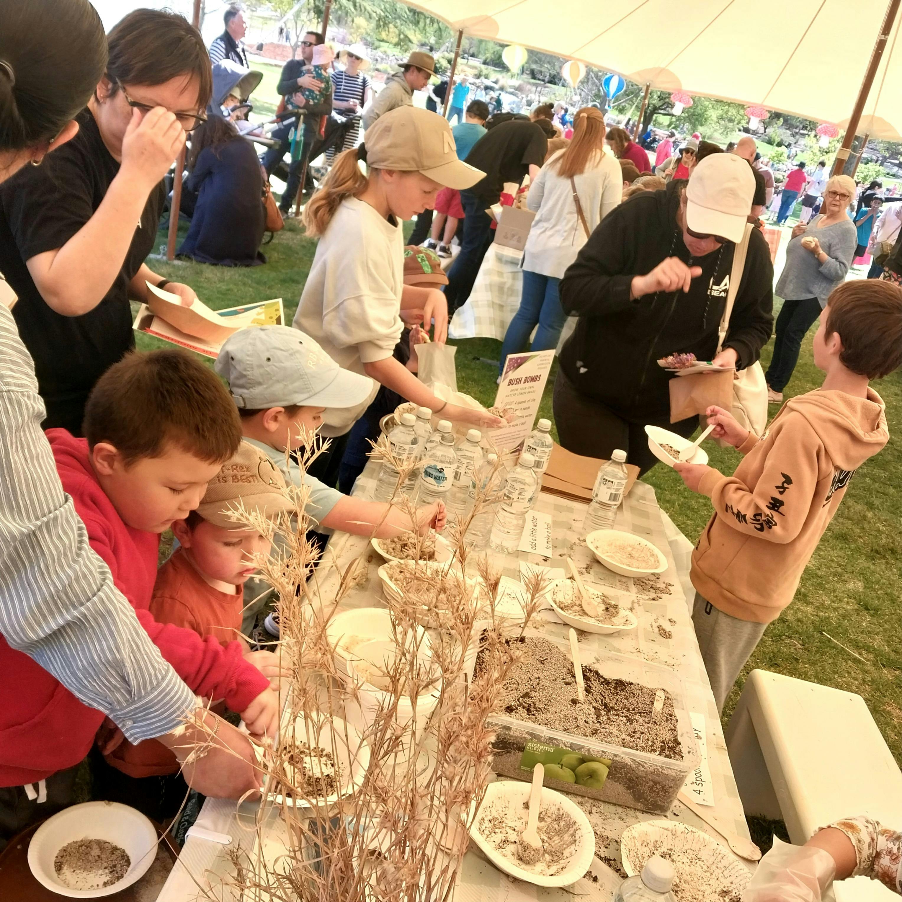 Children experiencing native plants for growing, and eating