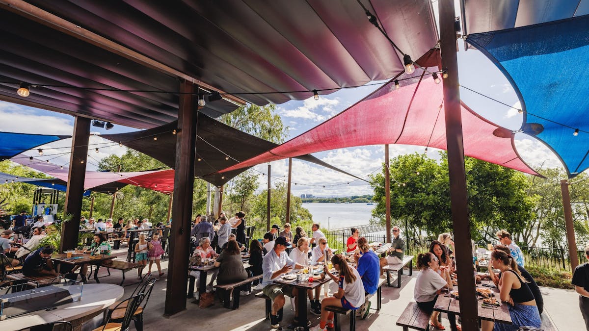 Guests enjoying the outside seating in the DogTap Pation section by the Brisbane River