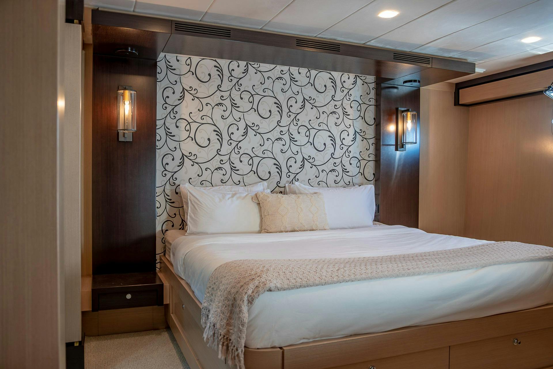 King size bed in main suite of Texas T motor yacht in Whitsundays