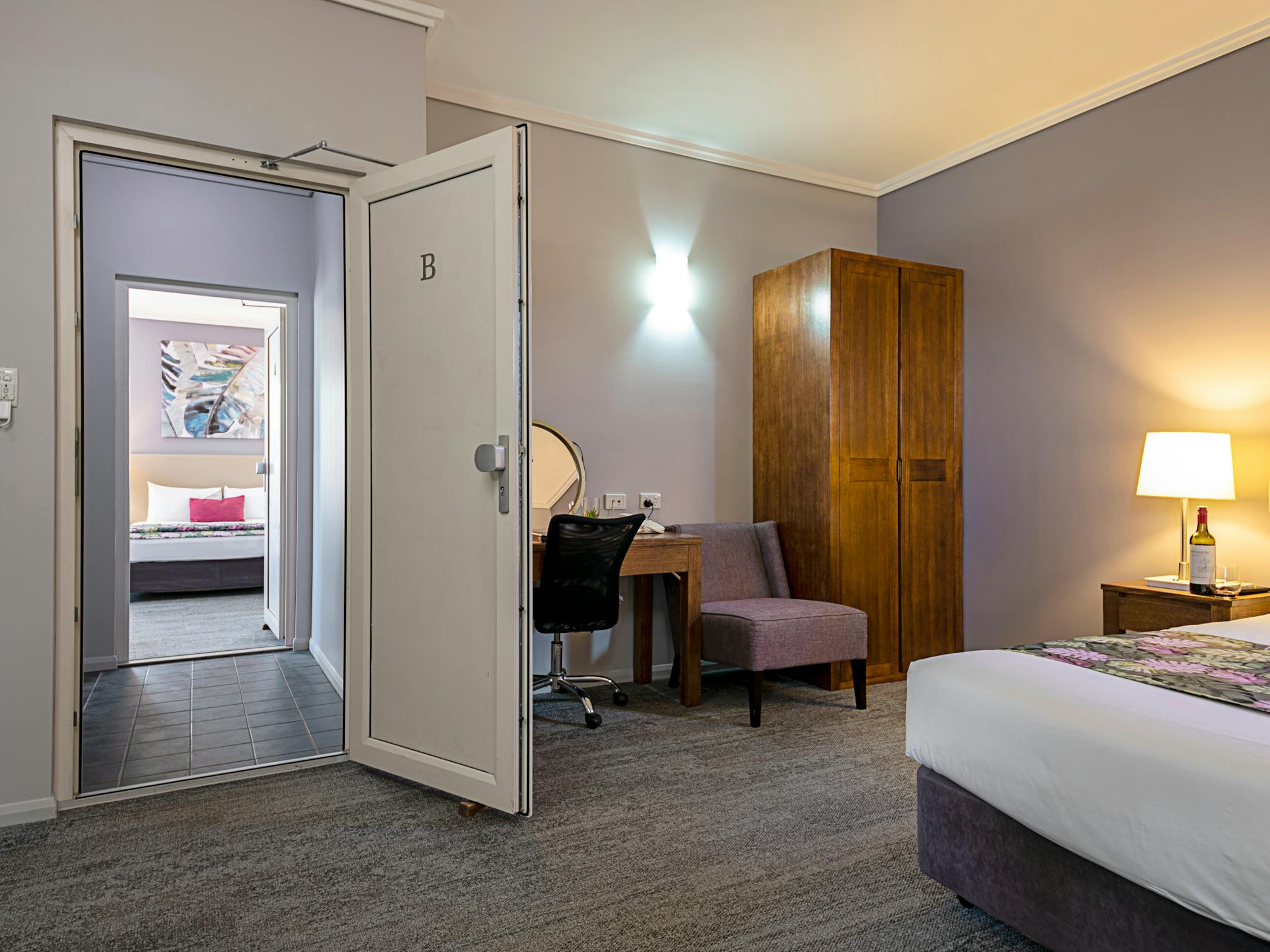 Two separate suites with two bathrooms adjoined by a private foyer Two separate suites with two bathrooms adjoined by a private foyer