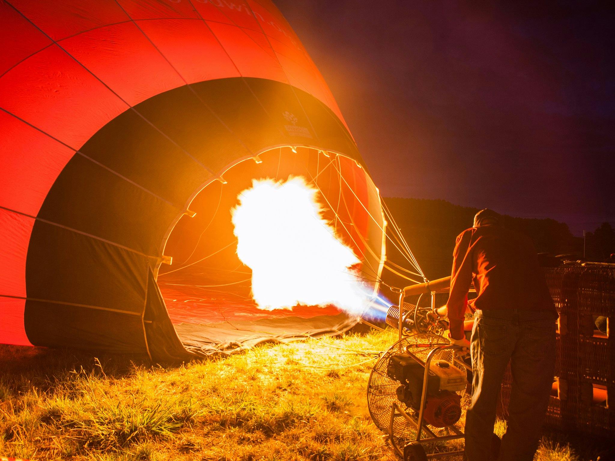 Operator inflating a hot air balloon