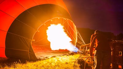 Operator inflating a hot air balloon