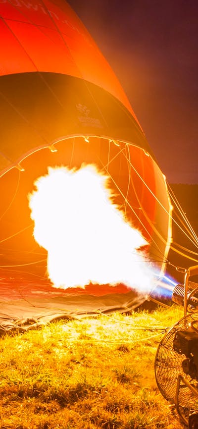 Operator inflating a hot air balloon