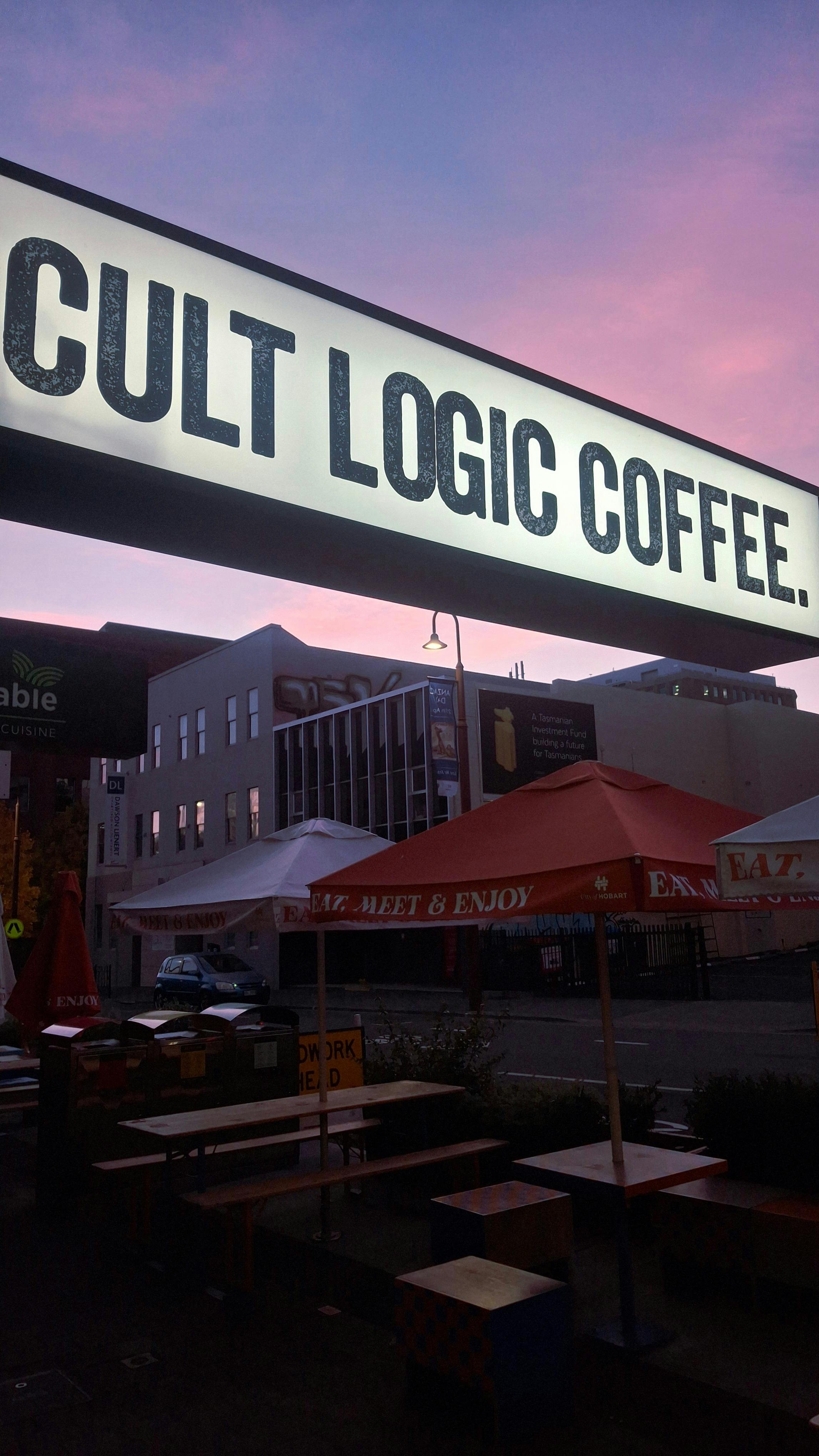 Shop sign with Collin Street background
