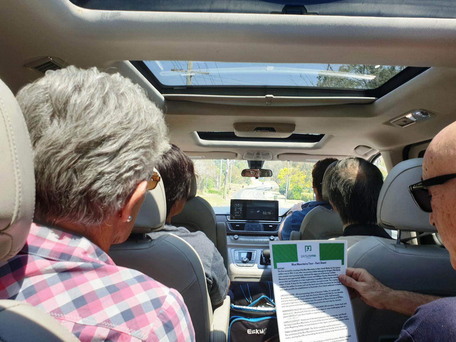 View from back seat of a van full of people