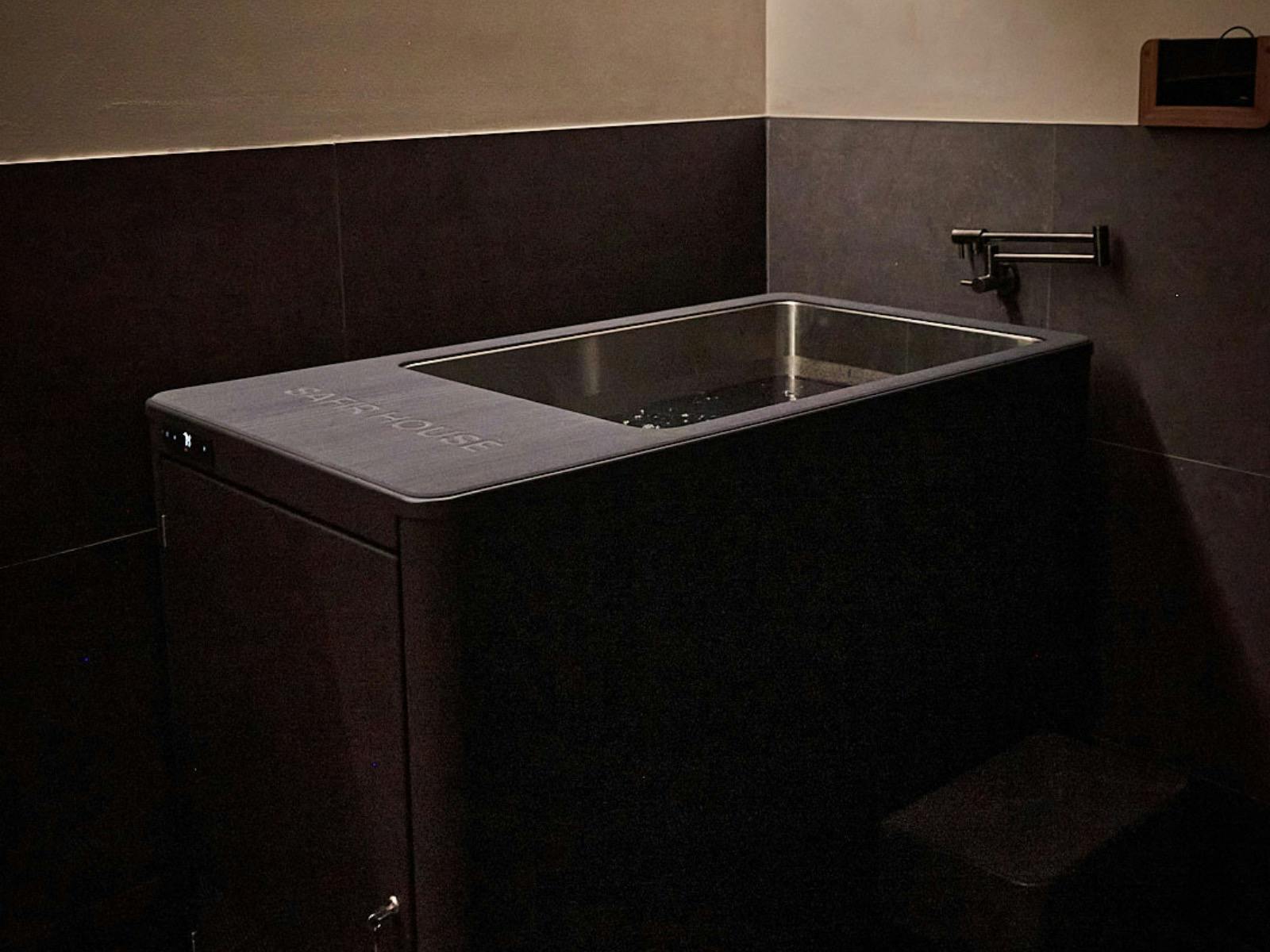 picture of a cold plunge with an iPad on the wall to show guided ice bath experience