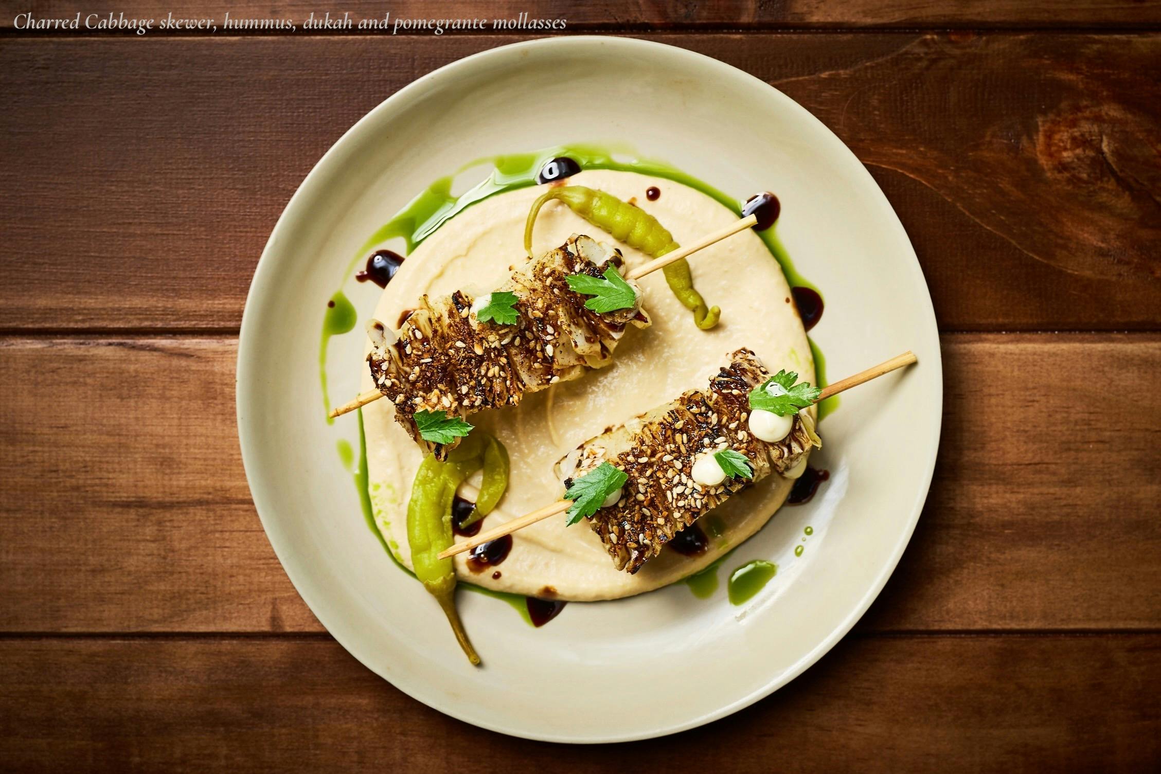 Wood-fired cabbage skewer with dukkah and hummus