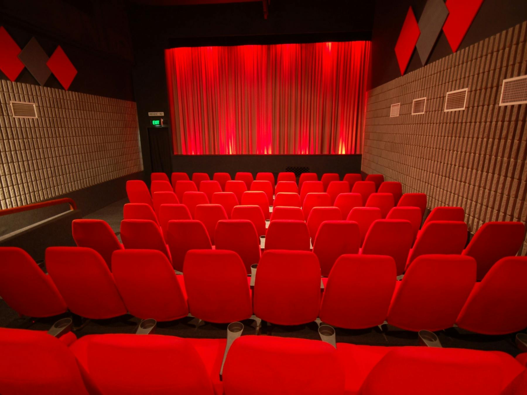 Inside view of the Bowen cinema furnished with red chairs