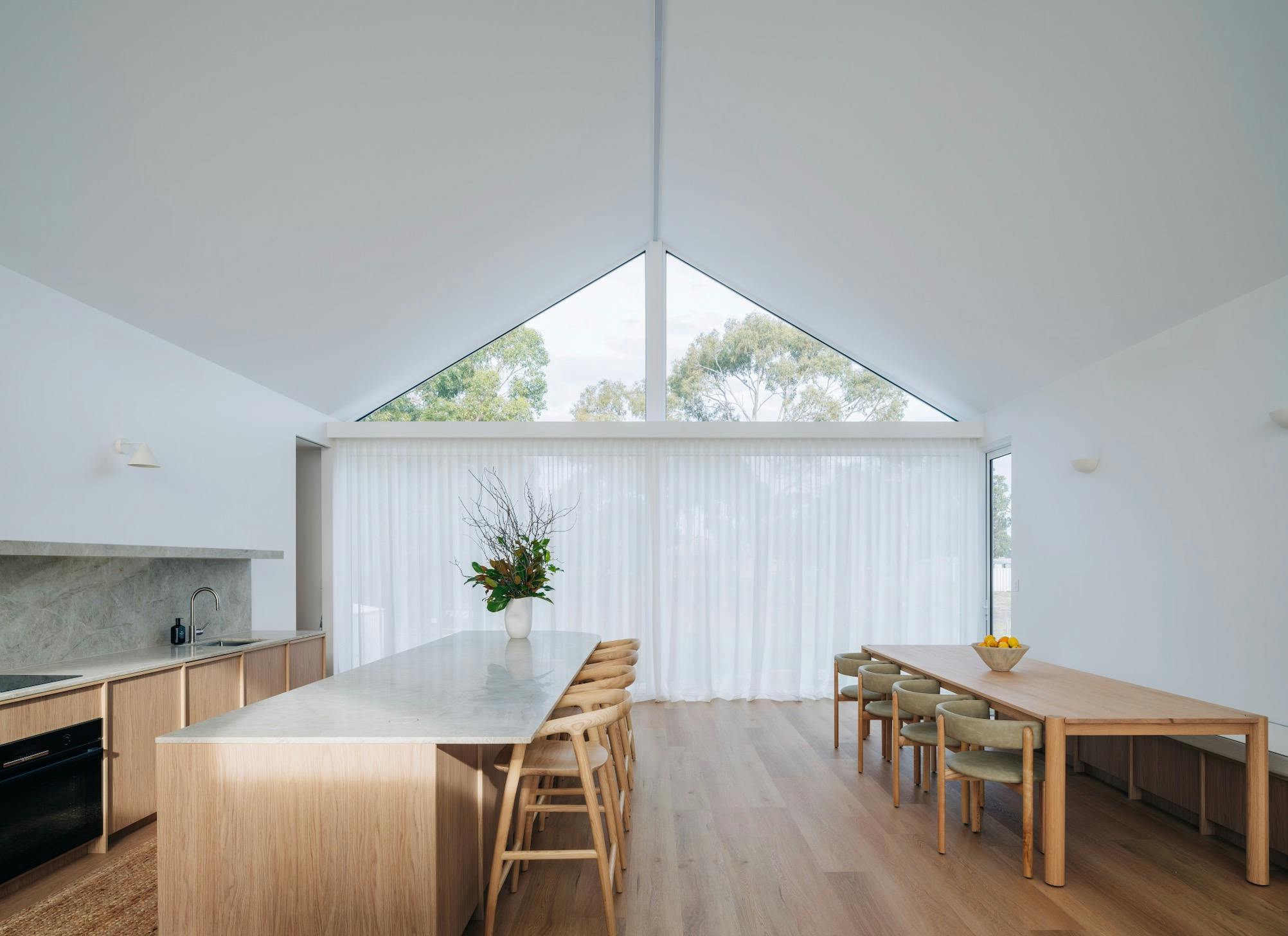 large open plan kitchen and dining with seating for 10 people