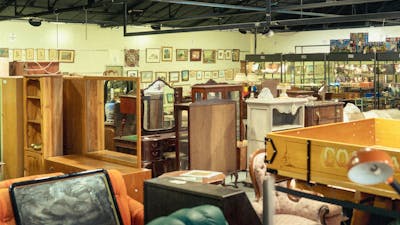 Shot of the inside of the EHVA showroom showing a selection of antique furniture and art
