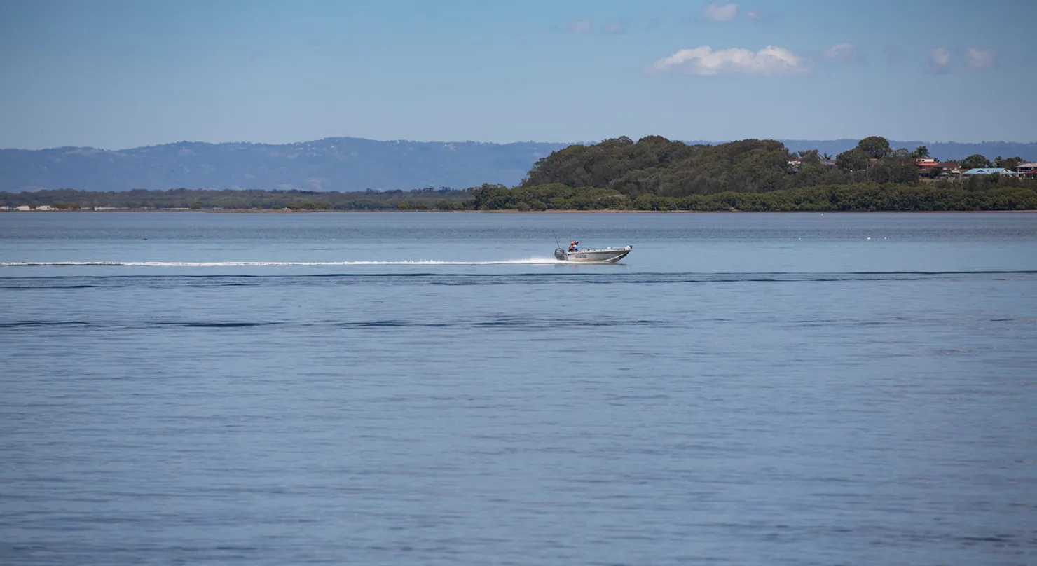 Tinny gliding gliding over the water in Pumicestone Passage