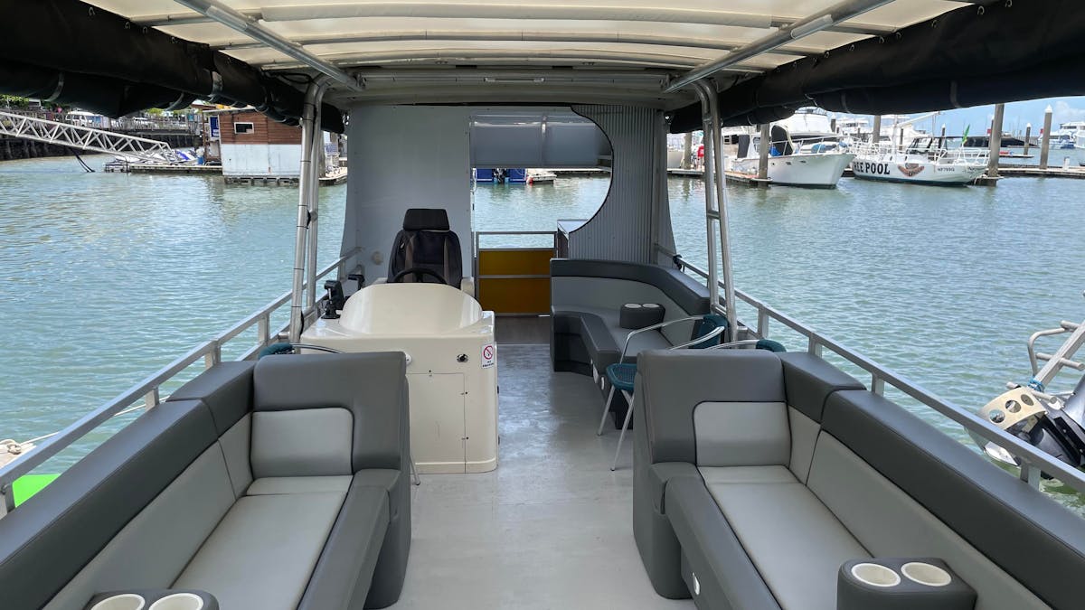 Wide shot of the inside of the Cairns River Sightseeing Cruise  Boat on the Trinity Inlet