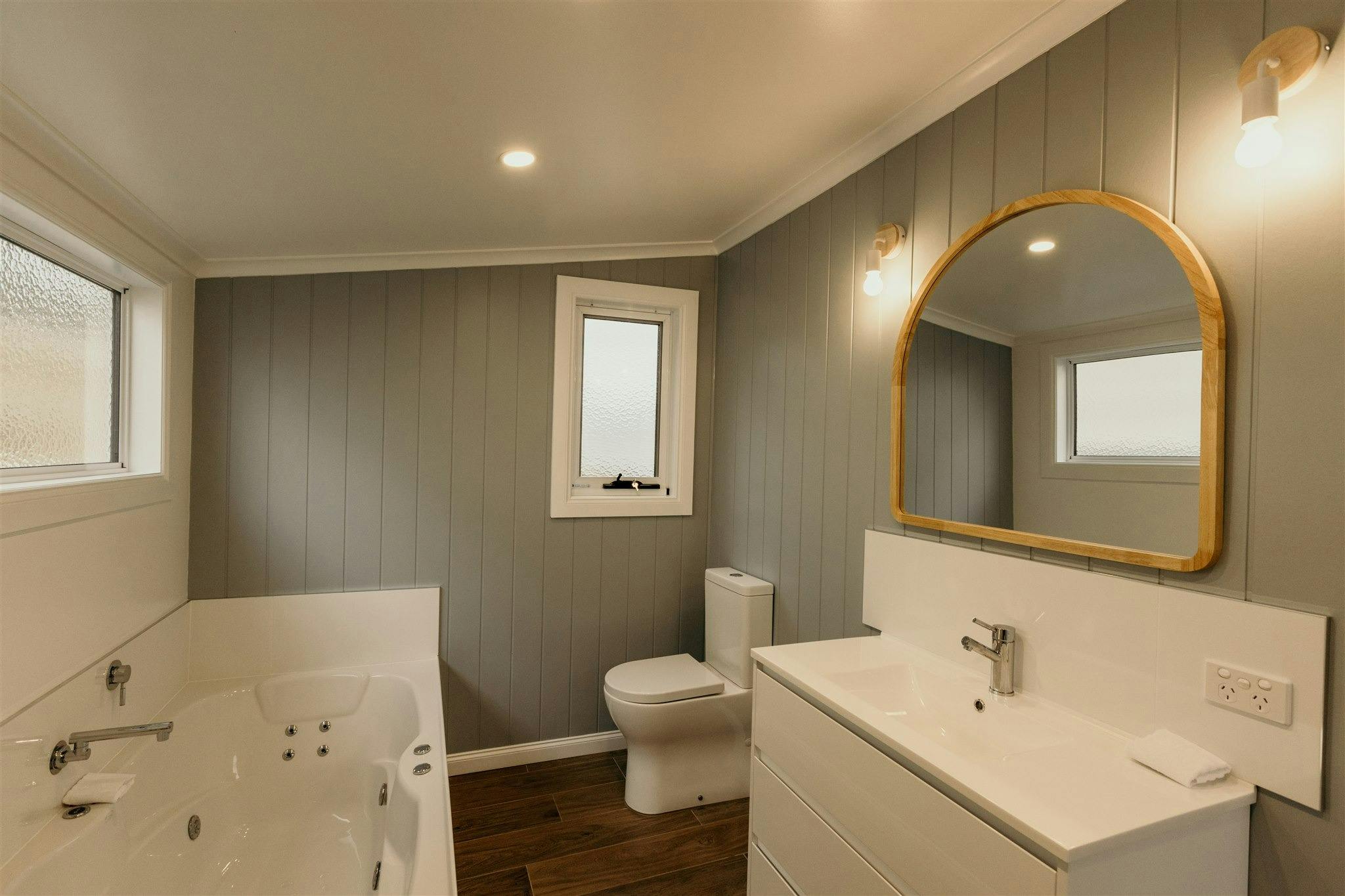 spa bath, large vanity, toilet and walkin shower, good heating, modern and new