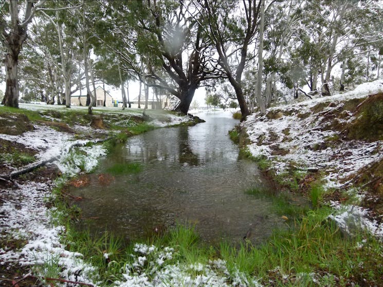 Snow by the water