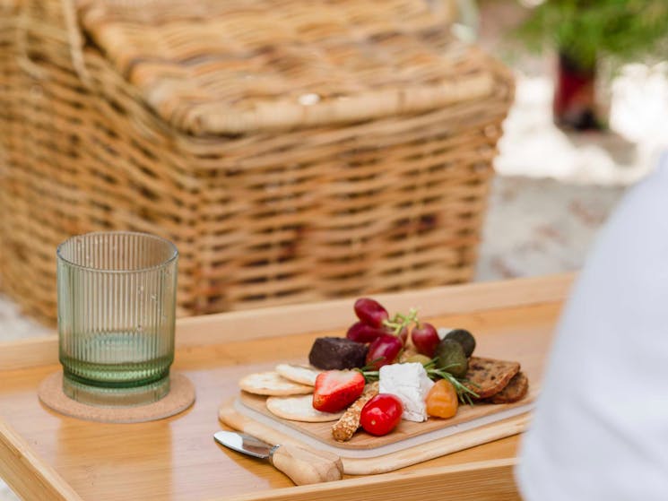 Picnic table with food and  cup
