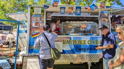 Image of food van serving people authentic German street food like bratwursts and kranskys