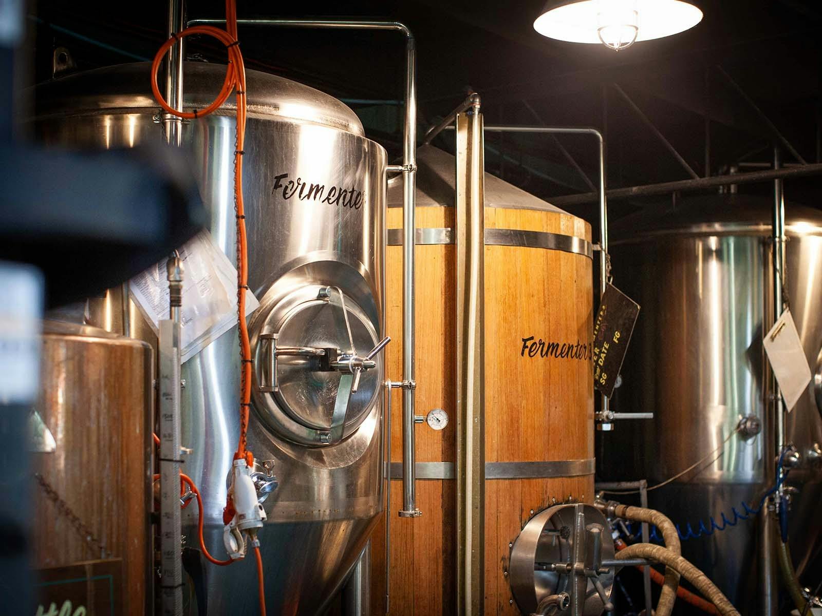 Stainless steel and wooden beer tanks Stainless steel and wooden beer tanks